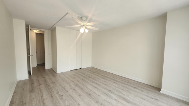 405 N Wabash Ave Unit 102, Chicago, IL 60611 - unfurnished bedroom with light wood-style floors, baseboards, ceiling fan, and a closet