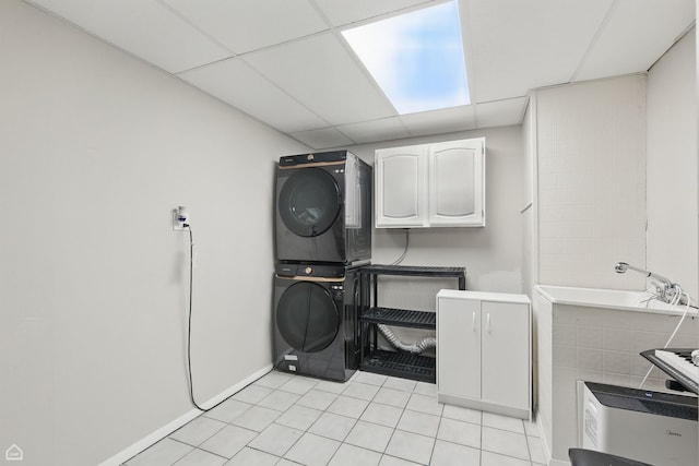 421 Pintail Ln, Deerfield, IL 60015 - laundry area featuring stacked washer and clothes dryer and light tile patterned floors