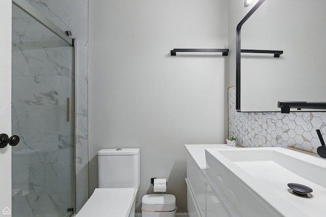 421 Pintail Ln, Deerfield, IL 60015 - bathroom with vanity, a marble finish shower, backsplash, and toilet