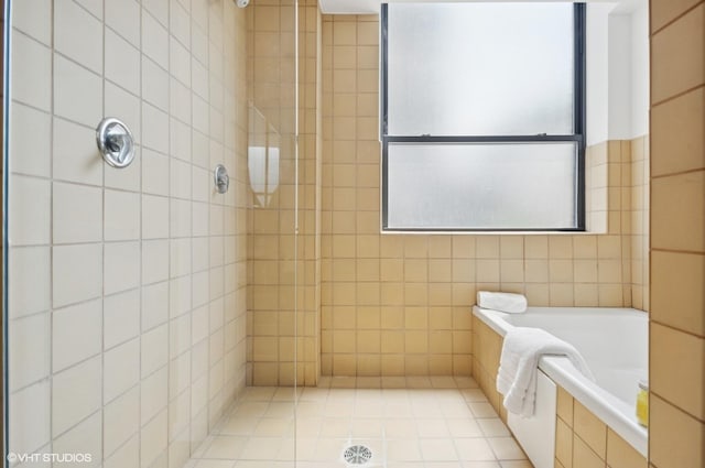 120 E Cullerton St Unit 402, Chicago, IL 60616 - bathroom with tile walls, a bath, and tiled shower