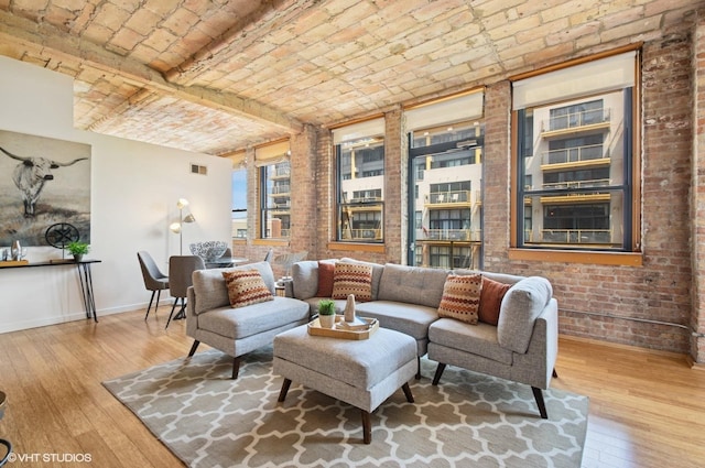 120 E Cullerton St Unit 402, Chicago, IL 60616 - living area featuring brick ceiling, hardwood / wood-style flooring, and brick wall