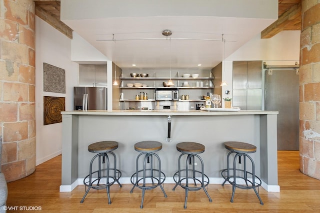 120 E Cullerton St Unit 402, Chicago, IL 60616 - bar area with stainless steel appliances and light wood-style flooring