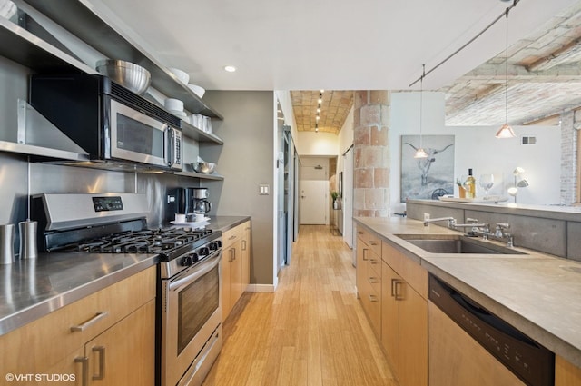 120 E Cullerton St Unit 402, Chicago, IL 60616 - kitchen with stainless steel counters, appliances with stainless steel finishes, open shelves, light wood-style floors, and hanging light fixtures