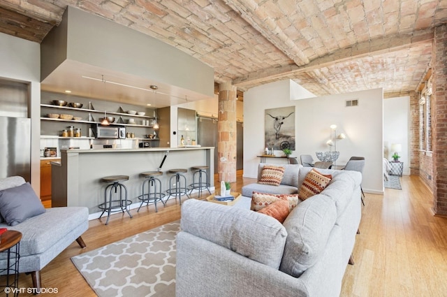 120 E Cullerton St Unit 402, Chicago, IL 60616 - living room featuring brick ceiling and light wood finished floors