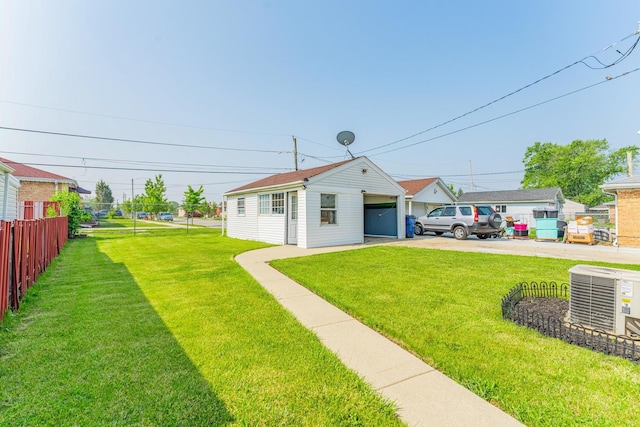 9727 Richard Ave, Franklin Park, IL 60131 - view of yard featuring central AC and concrete driveway