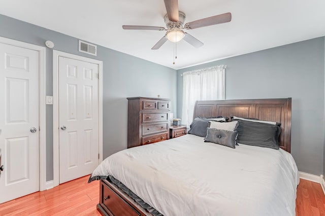 9727 Richard Ave, Franklin Park, IL 60131 - bedroom with light wood-type flooring, baseboards, and ceiling fan