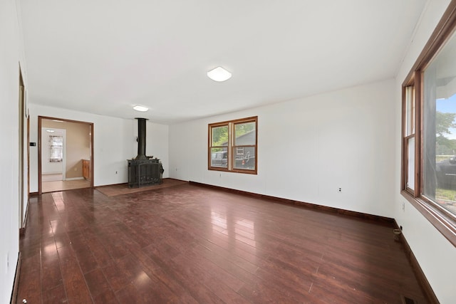 5460B W State Route 17, Kankakee, IL 60901 - unfurnished living room featuring a wood stove and dark wood-style floors