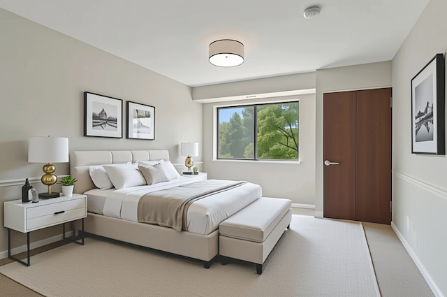 101 Old Oak Dr Unit 212, Buffalo Grove, IL 60089 - bedroom featuring baseboards and light colored carpet