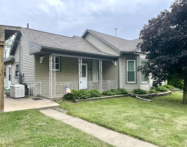 1003 3rd St, Lasalle, IL 61301 - bungalow featuring covered porch, a front yard, and a shingled roof