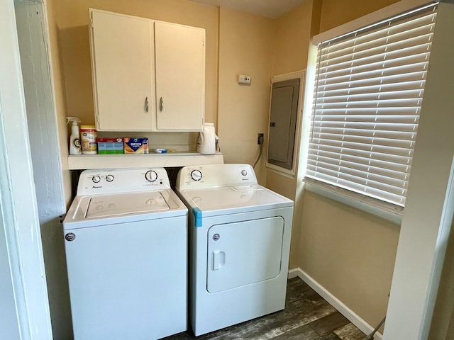 1003 3rd St, Lasalle, IL 61301 - washroom featuring electric panel, independent washer and dryer, dark wood-type flooring, and cabinet space