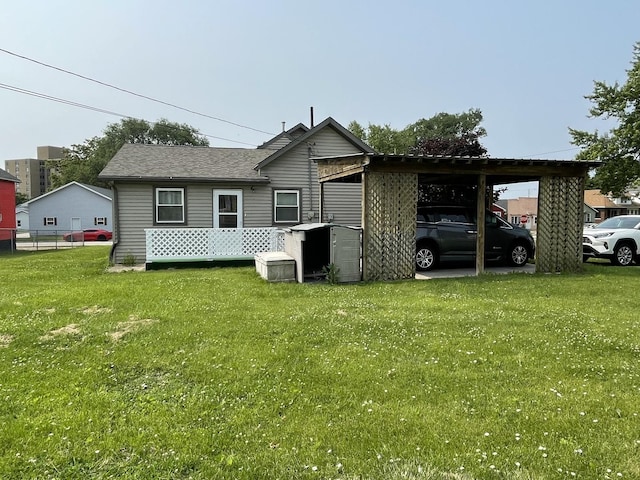 1003 3rd St, Lasalle, IL 61301 - back of property featuring a carport and roof with shingles