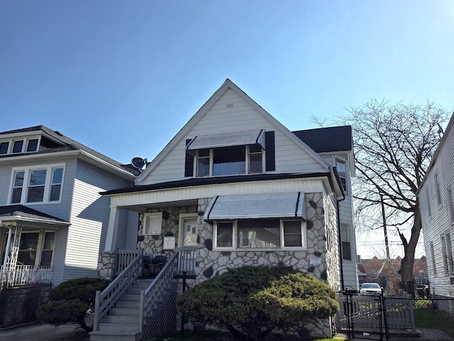 10535 S Wabash Ave, Chicago, IL 60628 - view of front of house with stone siding and a porch