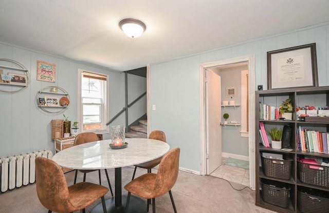 3102 Edina Blvd, Zion, IL 60099 - dining area featuring radiator heating unit, stairway, and carpet