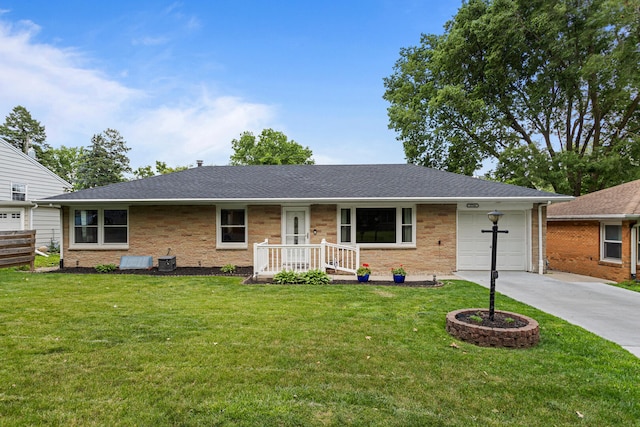 1716 Park Haven Dr, Champaign, IL 61820 - ranch-style home with driveway, an attached garage, a front yard, and roof with shingles