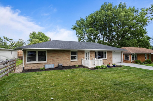 1716 Park Haven Dr, Champaign, IL 61820 - ranch-style house featuring a garage, driveway, brick siding, and roof with shingles