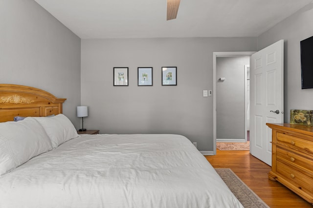 1716 Park Haven Dr, Champaign, IL 61820 - bedroom featuring wood finished floors, ceiling fan, and baseboards