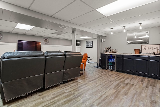 1716 Park Haven Dr, Champaign, IL 61820 - living area featuring beverage cooler, wet bar, light wood-style floors, and a drop ceiling