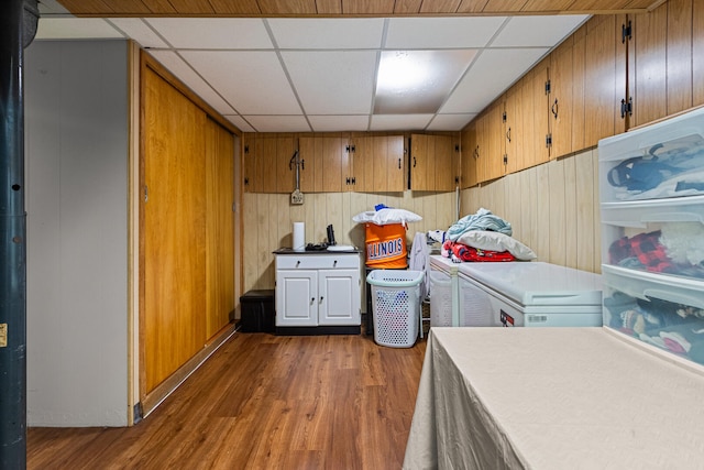 1716 Park Haven Dr, Champaign, IL 61820 - washroom with washing machine and clothes dryer, dark wood-style flooring, and wood walls