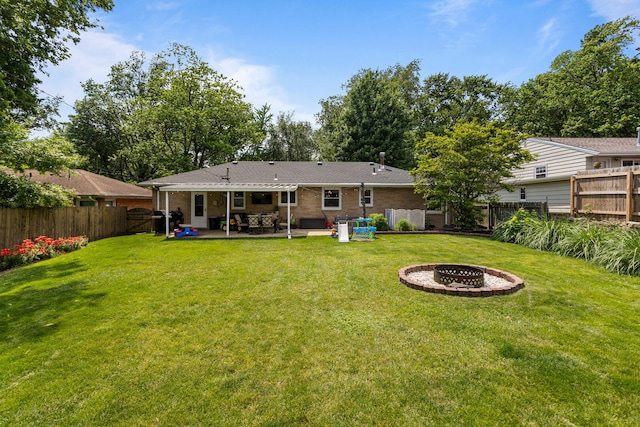1716 Park Haven Dr, Champaign, IL 61820 - rear view of property featuring a patio, an outdoor fire pit, and brick siding