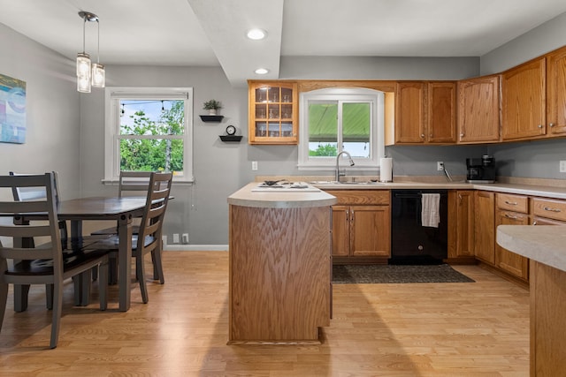 1716 Park Haven Dr, Champaign, IL 61820 - kitchen featuring black dishwasher, a sink, recessed lighting, light wood-type flooring, and plenty of natural light