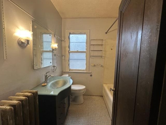 full bathroom featuring radiator, vanity, toilet, bathtub / shower combination, and tile patterned flooring