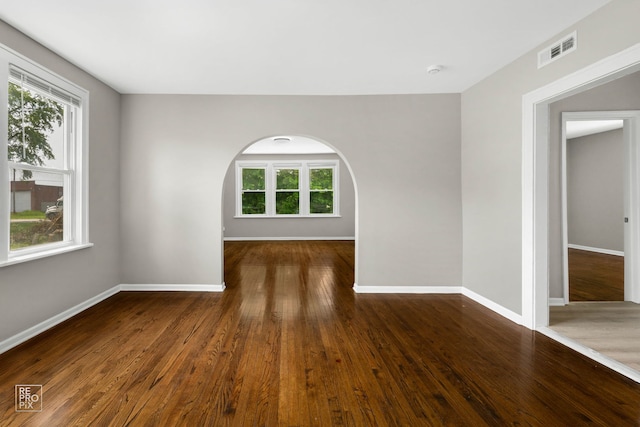 13739 Kildare Ave, Crestwood, IL 60418 - spare room featuring plenty of natural light, wood finished floors, and arched walkways