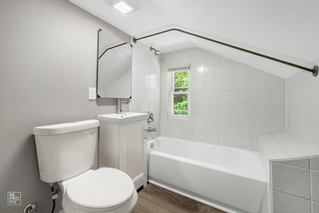 13739 Kildare Ave, Crestwood, IL 60418 - full bath featuring vaulted ceiling, toilet, wood finished floors,  shower combination, and vanity