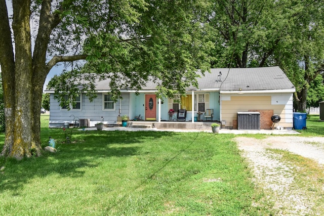 502 Short St, Cornell, IL 61319 - single story home featuring covered porch, a front lawn, and driveway