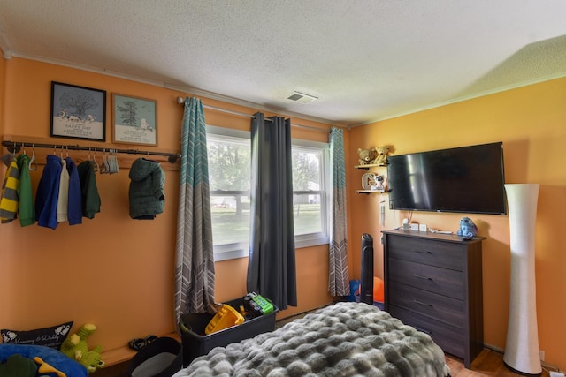 502 Short St, Cornell, IL 61319 - bedroom with crown molding and a textured ceiling