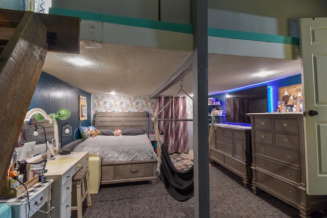 502 Short St, Cornell, IL 61319 - bedroom with a textured ceiling and dark carpet