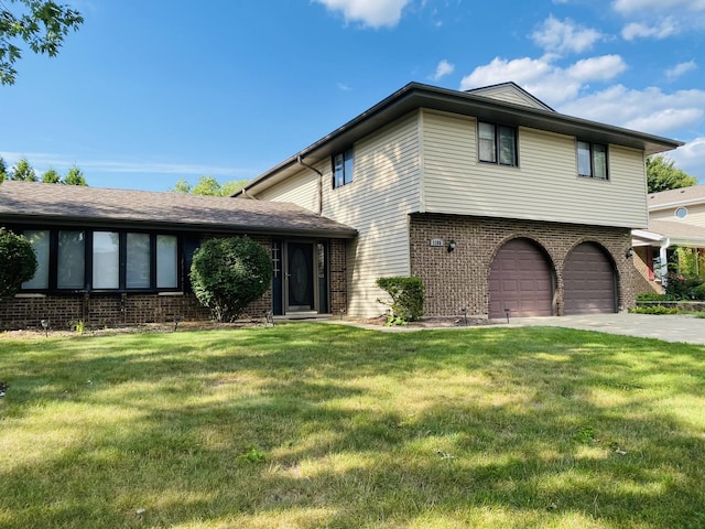 1106 Westfield Ln, Schaumburg, IL 60193 - view of front facade with brick siding, an attached garage, and a front yard