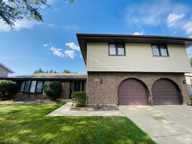 1106 Westfield Ln, Schaumburg, IL 60193 - view of front of property with brick siding, driveway, an attached garage, and a front lawn