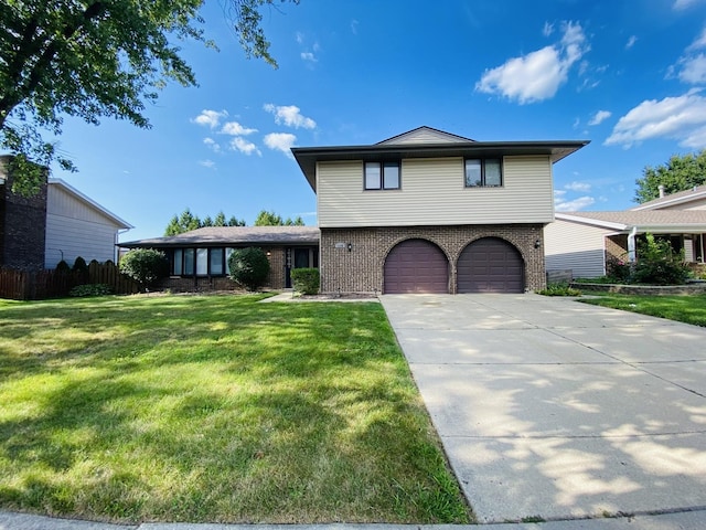 1106 Westfield Ln, Schaumburg, IL 60193 - view of front of home featuring an attached garage, brick siding, and driveway