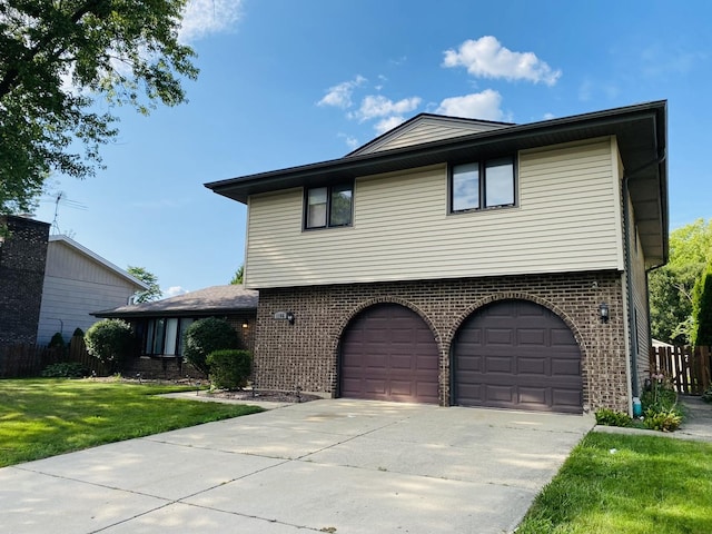 1106 Westfield Ln, Schaumburg, IL 60193 - view of front facade with brick siding, concrete driveway, a garage, and a front lawn
