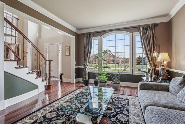 24 Wood Oaks Dr, South Barrington, IL 60010 - living area with stairway, wood finished floors, crown molding, and baseboards