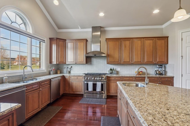 24 Wood Oaks Dr, South Barrington, IL 60010 - kitchen featuring wall chimney exhaust hood, stainless steel appliances, a sink, brown cabinetry, and crown molding