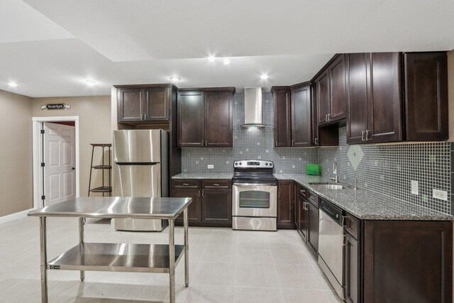 24 Wood Oaks Dr, South Barrington, IL 60010 - kitchen with appliances with stainless steel finishes, wall chimney exhaust hood, dark brown cabinets, light stone counters, and recessed lighting