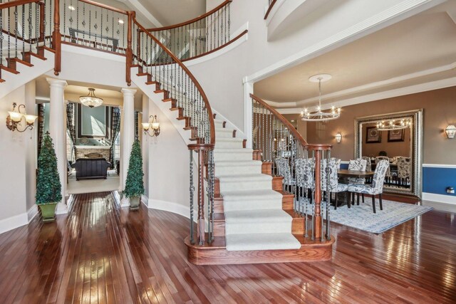 24 Wood Oaks Dr, South Barrington, IL 60010 - entrance foyer with stairway, a chandelier, baseboards, and ornamental molding