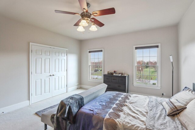 24 Wood Oaks Dr, South Barrington, IL 60010 - bedroom featuring carpet floors, baseboards, a closet, and ceiling fan