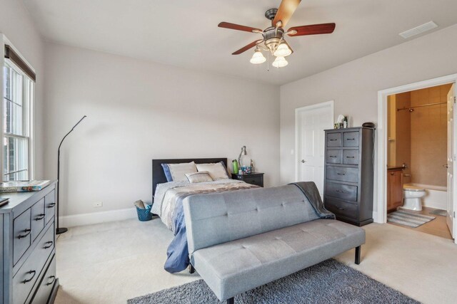 24 Wood Oaks Dr, South Barrington, IL 60010 - bedroom featuring light carpet, baseboards, connected bathroom, and ceiling fan