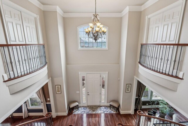 24 Wood Oaks Dr, South Barrington, IL 60010 - entrance foyer featuring a towering ceiling, wood finished floors, a chandelier, baseboards, and crown molding