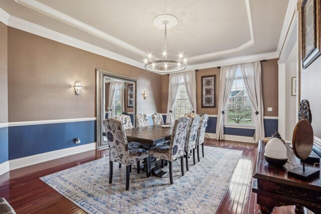 24 Wood Oaks Dr, South Barrington, IL 60010 - dining area featuring a chandelier, a tray ceiling, wood finished floors, baseboards, and crown molding