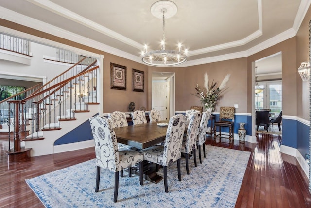 24 Wood Oaks Dr, South Barrington, IL 60010 - dining room featuring a chandelier, a tray ceiling, hardwood / wood-style flooring, stairs, and ornamental molding