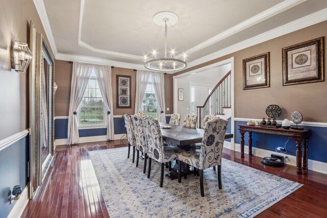 24 Wood Oaks Dr, South Barrington, IL 60010 - dining room featuring a chandelier, stairs, wood finished floors, a raised ceiling, and ornamental molding