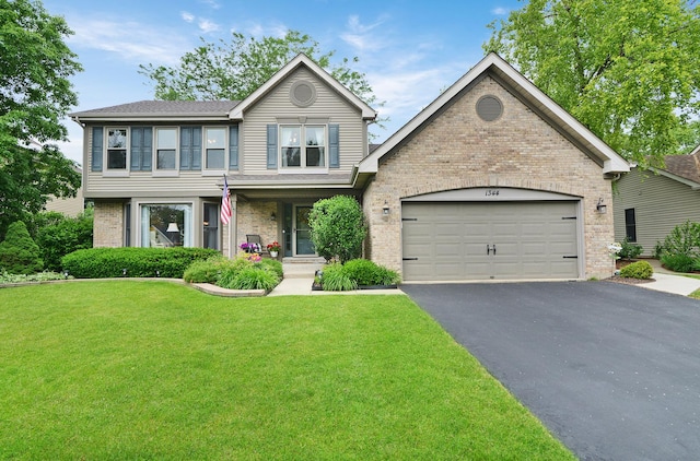 1344 Saddlebrook Rd, Bartlett, IL 60103 - view of front facade featuring asphalt driveway, a front lawn, brick siding, a garage, and a shingled roof