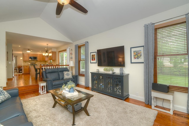 1344 Saddlebrook Rd, Bartlett, IL 60103 - living room with ceiling fan, light wood finished floors, a chandelier, and lofted ceiling