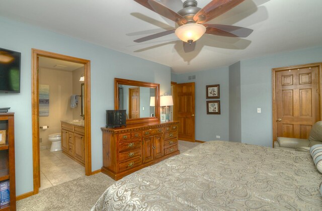 1344 Saddlebrook Rd, Bartlett, IL 60103 - bedroom featuring light carpet, connected bathroom, light tile patterned flooring, and ceiling fan