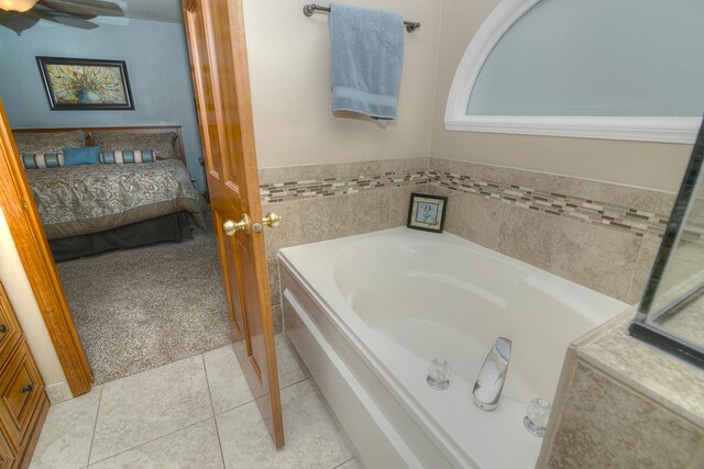 1344 Saddlebrook Rd, Bartlett, IL 60103 - ensuite bathroom featuring a garden tub, ceiling fan, and tile patterned floors