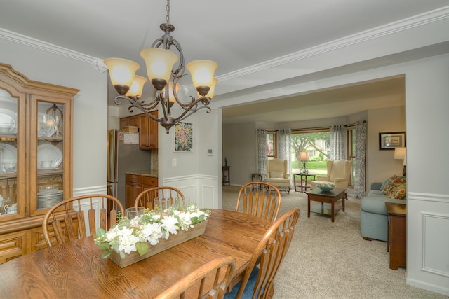 1344 Saddlebrook Rd, Bartlett, IL 60103 - dining area featuring a chandelier, light carpet, a wainscoted wall, and ornamental molding
