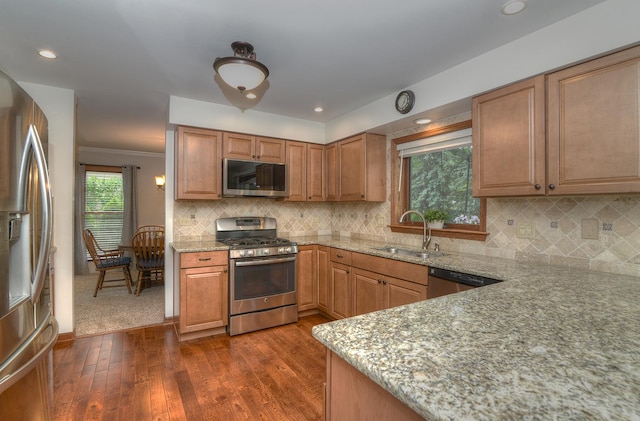 1344 Saddlebrook Rd, Bartlett, IL 60103 - kitchen featuring appliances with stainless steel finishes, light stone counters, dark wood-style floors, backsplash, and crown molding